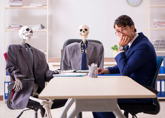 boring business meeting with two skeletons