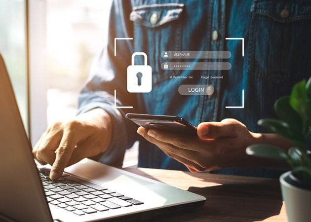 security screen as man logs in on phone and laptop devices