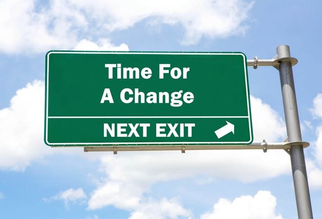road sign reading 'time for a change, next exit'