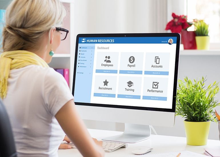 Woman using HR human resources software on computer