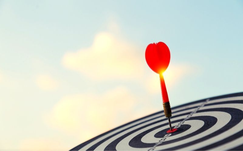 red arrow hitting bullseye on target