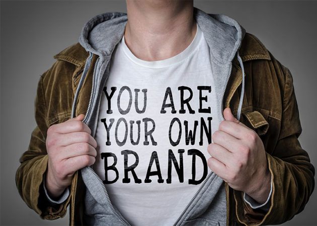 Man wearing t-shirt which reads 'You are your own brand'
