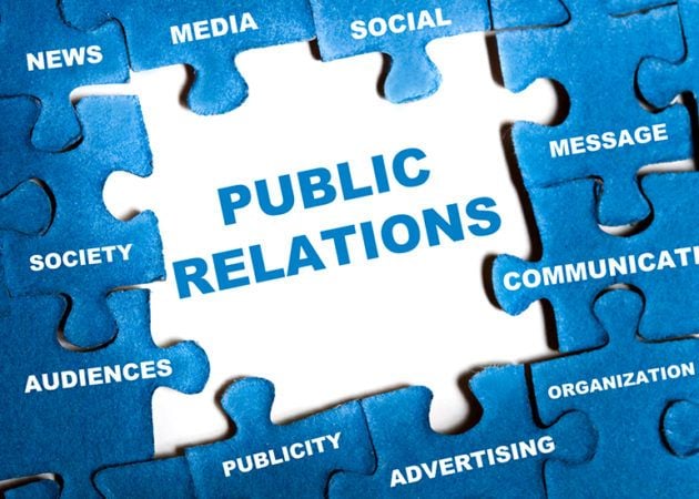 Puzzle with main piece showing 'public relations'