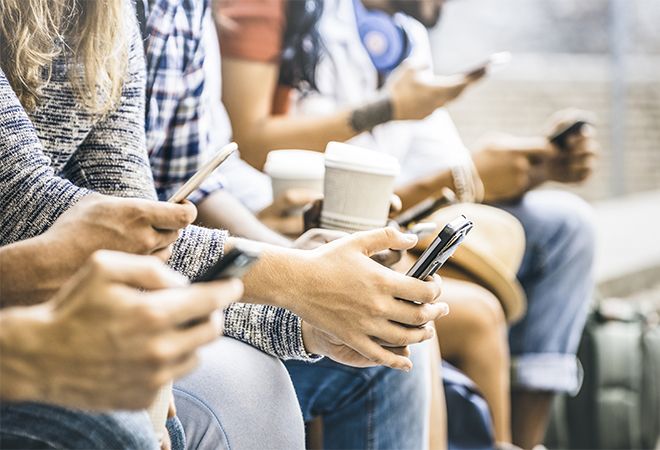 Group of people with mobile phones