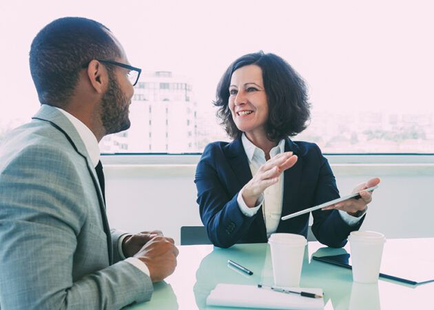Supportive manager meeting with colleague or employee