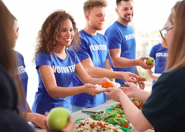 volunteers serving food