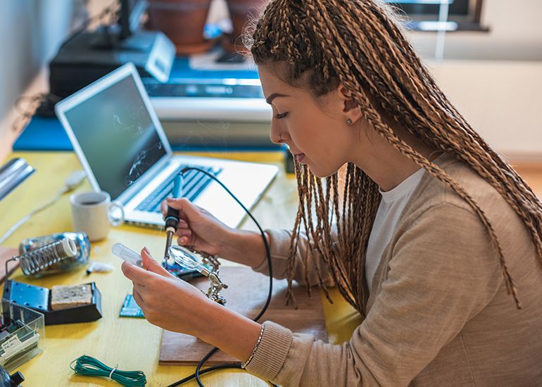 Woman working with electronics