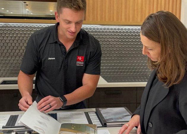 Jason Clarke talking kttchen designs with a client