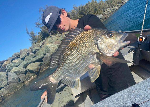 teen shows off his catch - 2 bent rods
