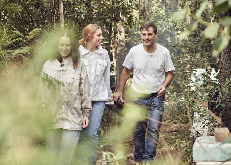 Beekeeper Andrew with daughters and business partners Joanna and Maya