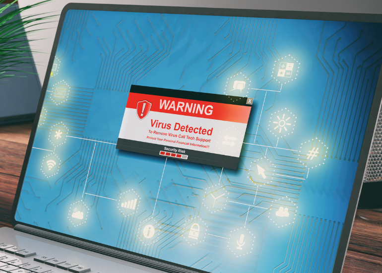 laptop screen with virus malware alert