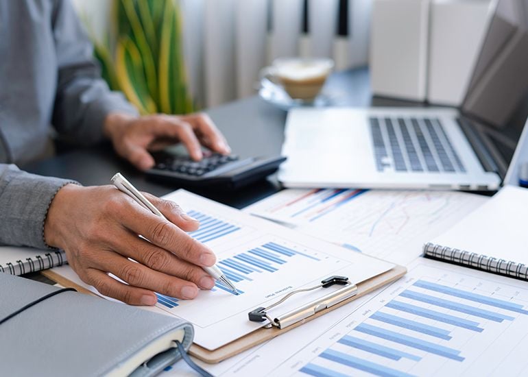 Accountant calculating business taxes