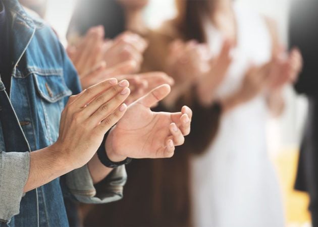 people applaud award winner