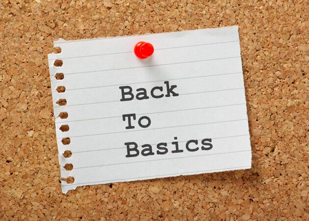 back to basics note pinned to corkboard