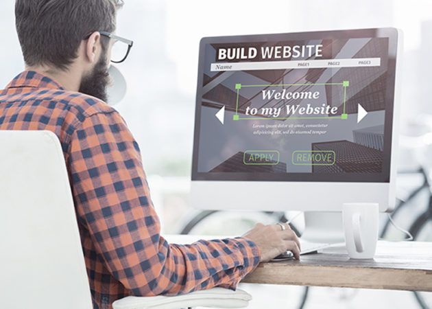 man using website builder to create website homepage