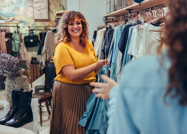 Women in clothing and fashion boutique