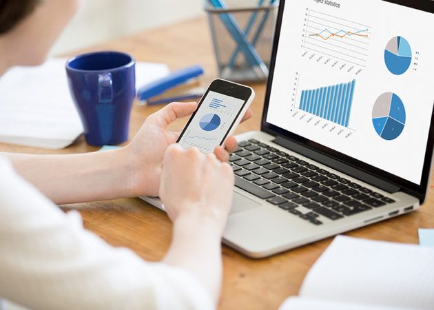 Woman using digital devices to track data 