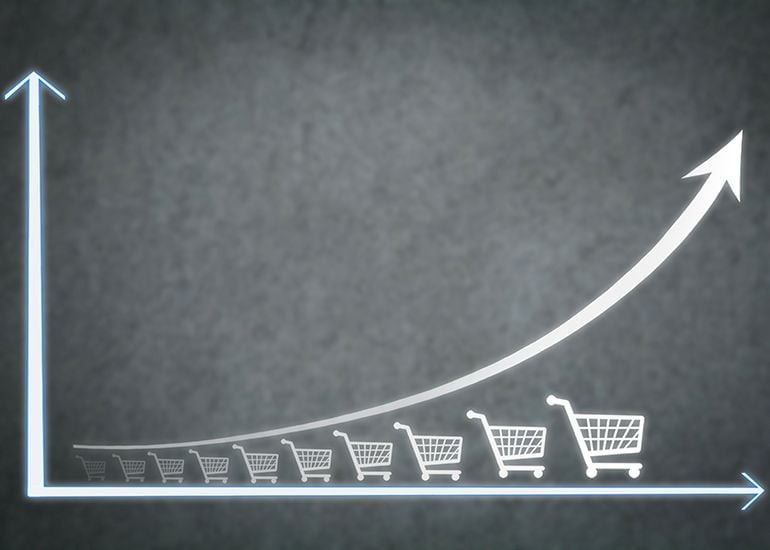 Graph with shopping cart graphics to show sales growth