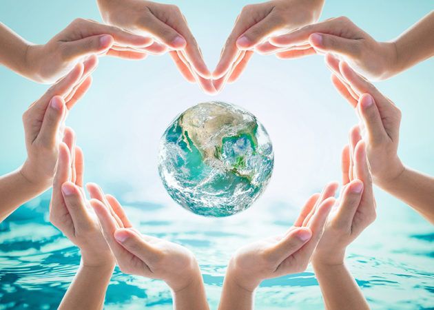 hands linked around a globe