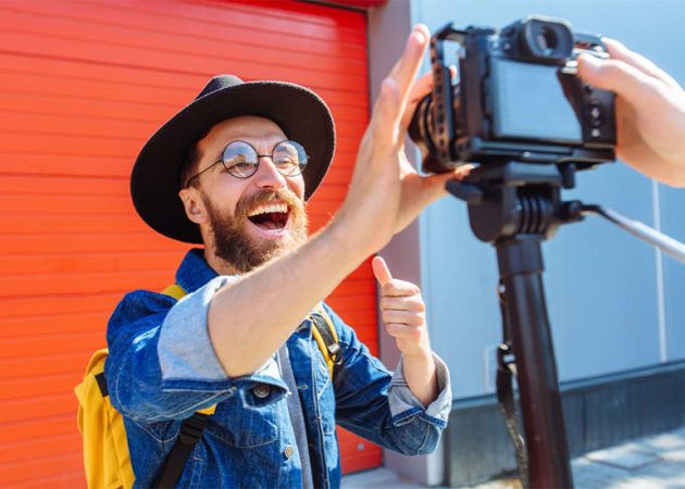 An influencer sets up a shot for social media