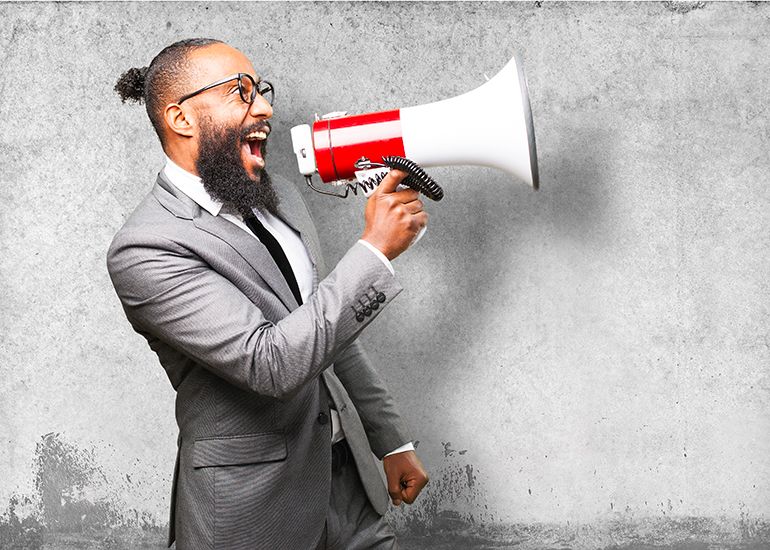 Pushy, excited salesperson shouting into loudspeaker
