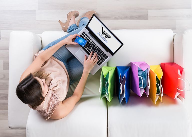 Woman on couch online shopping
