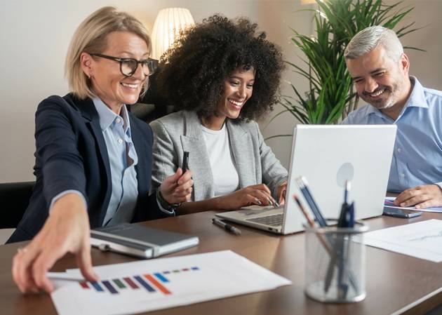 Business owners looking at benchmark data