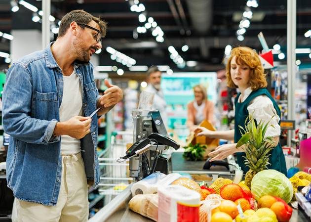 retail spending: man at checkout