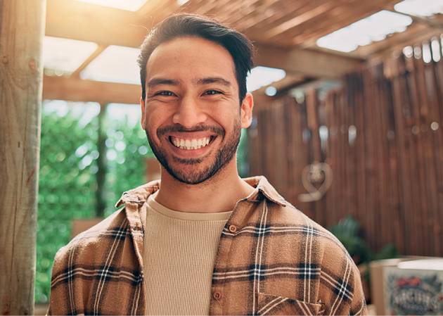 small business owner smiling - great mental health