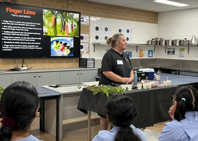 A student group getting an education on bush tucker from Oz Tucker owner Linda Dipper