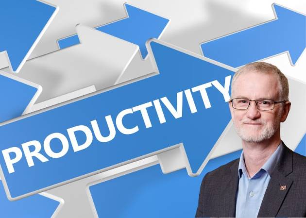 Matthew Addison Chair of COSBOA in front of an arrow pointing diagonally upward and the word productivity