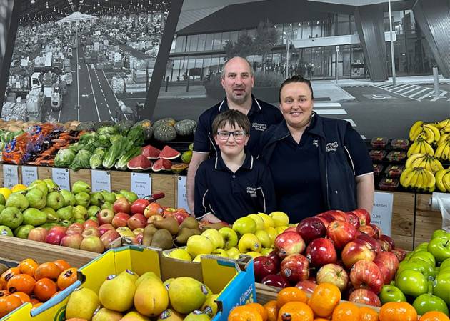 The Greaves family - founders of Greavesys Fruit and Veg stand behind an array of fresh produce.