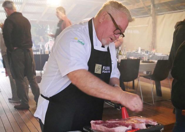 Guest chef seasoning some meat