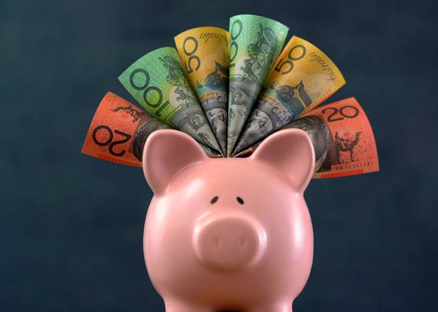 A piggy bank with australian dollars sticking out symbolising oayday super