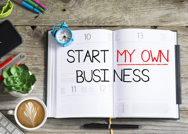 Book opened to a page that reads Start My Own Business